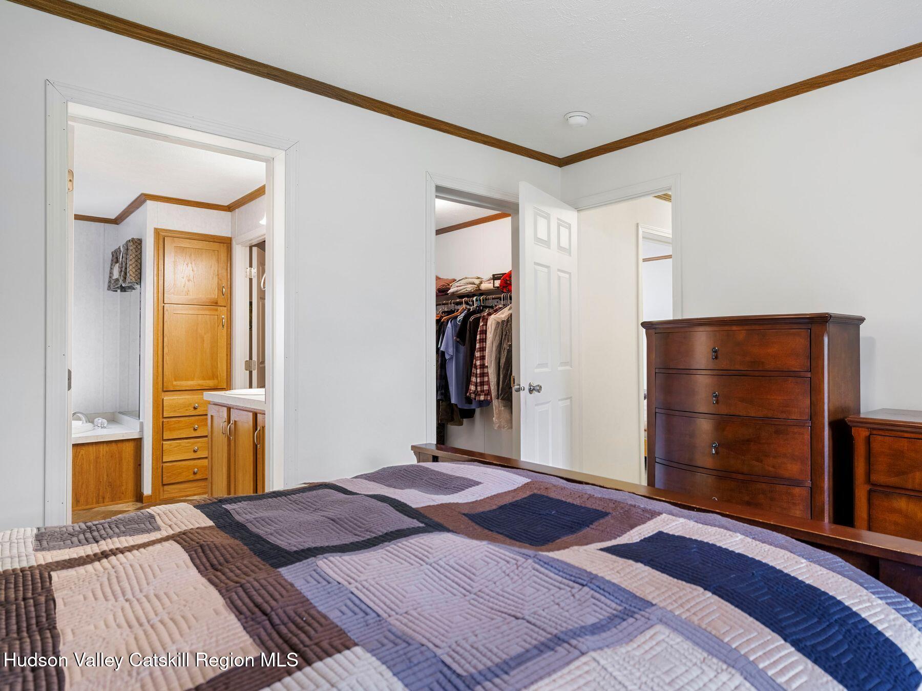 137 Mountain Pond View Road Gilboa, NY 12076 - Photo 26 of 38 a bedroom with a bed and a dresser