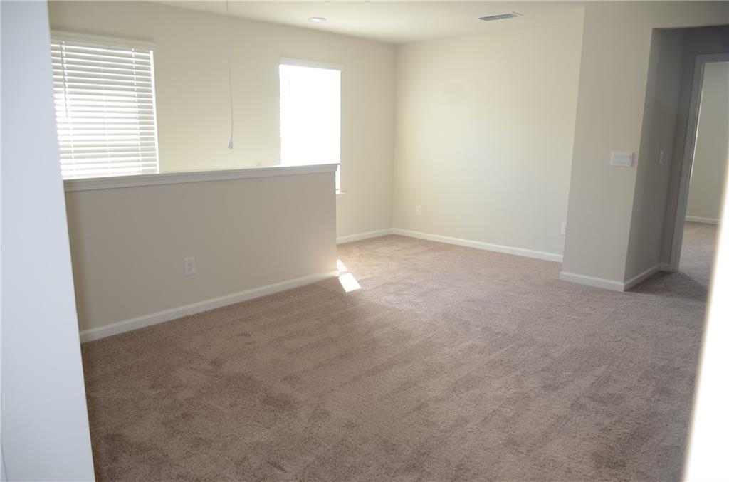 226 Wells Circle Canton, GA 30114 - Photo 13 of 27 an empty room with a window