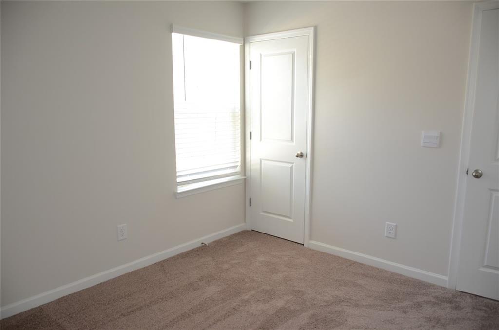 226 Wells Circle Canton, GA 30114 - Photo 15 of 27 an empty room with windows