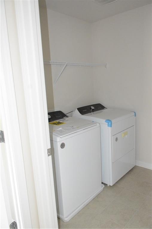 226 Wells Circle Canton, GA 30114 - Photo 16 of 27 a utility room with dryer and washer