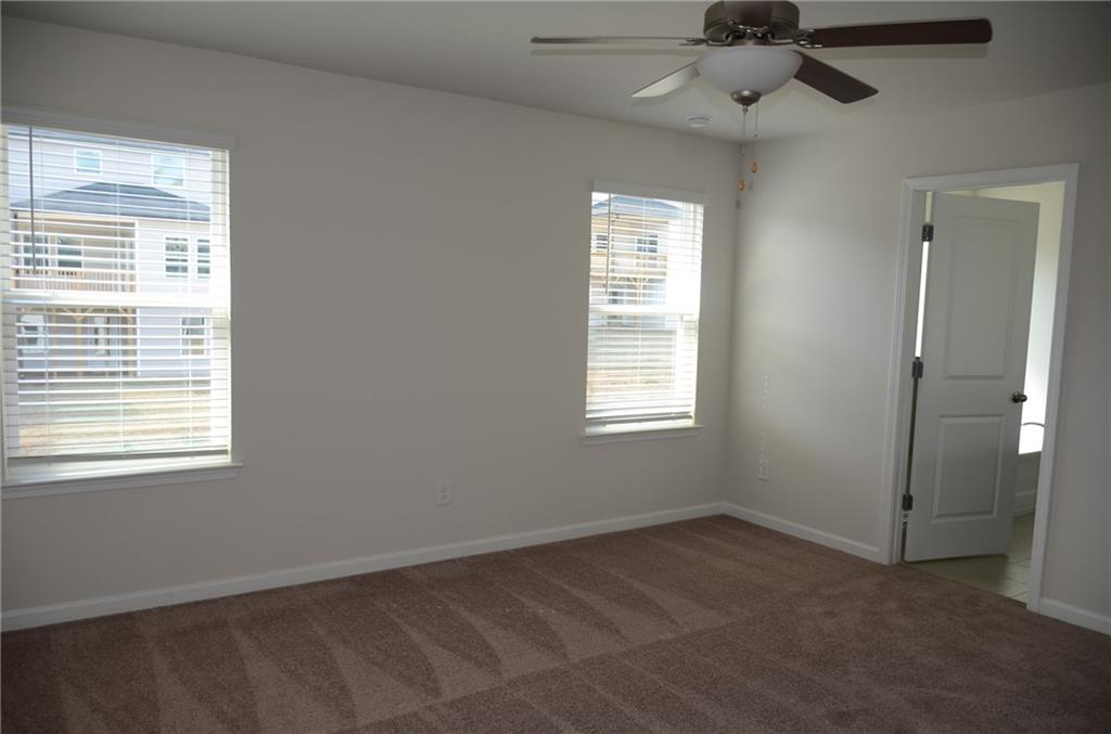 226 Wells Circle Canton, GA 30114 - Photo 17 of 27 a view of an empty room with a window