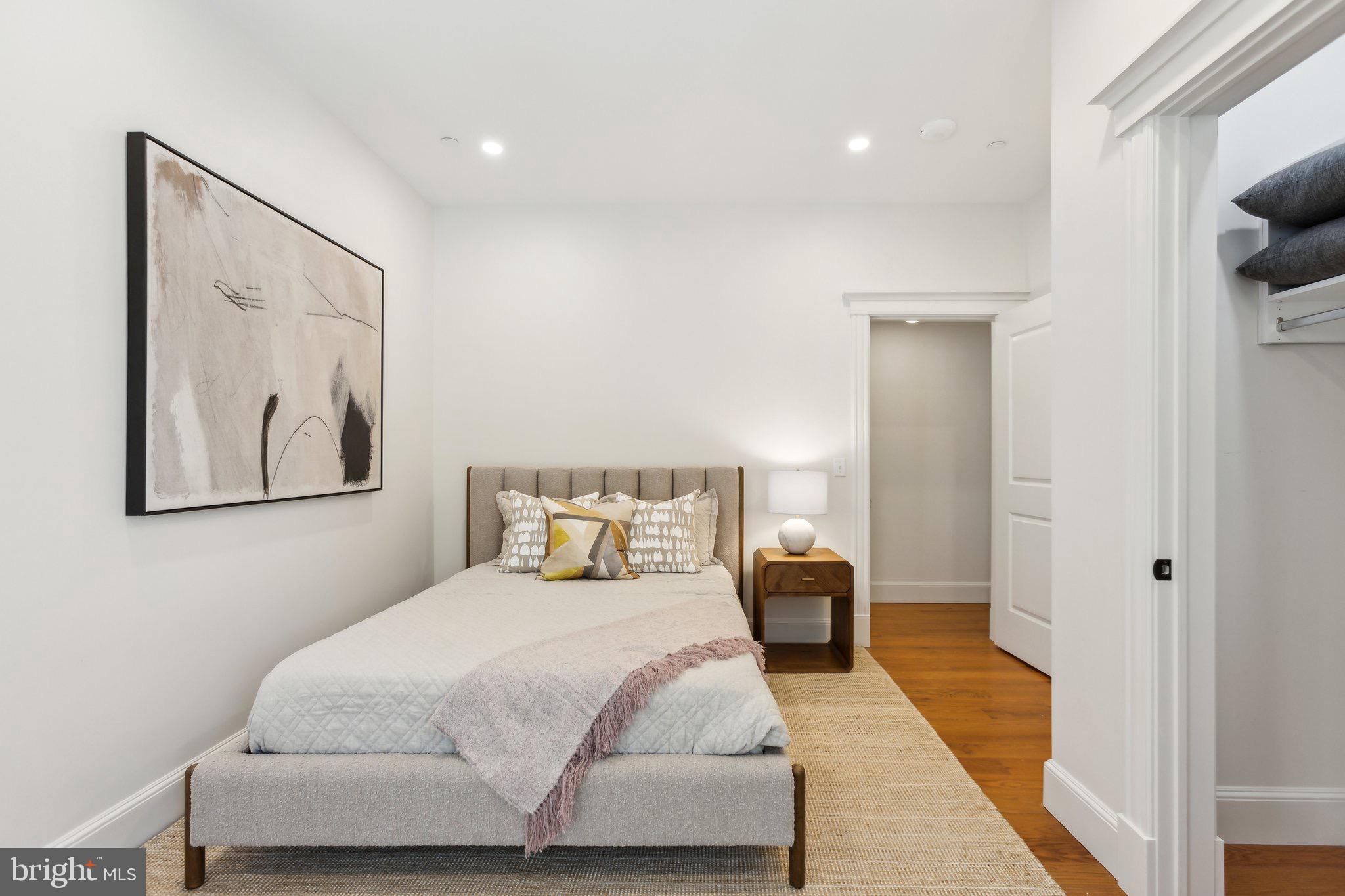1641 R Street Northwest, Unit 403 Washington, DC 20009 - Photo 19 of 36 Serene bedroom with modern elegance.