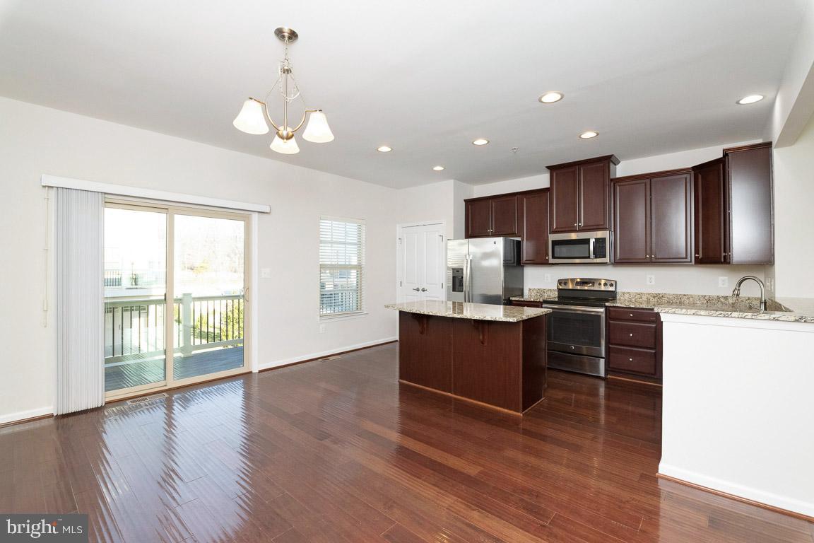 1048 Ramble Run Road Baltimore, MD 21220 - Photo 10 of 53 Hardwood floors throughout dining/kitchen area