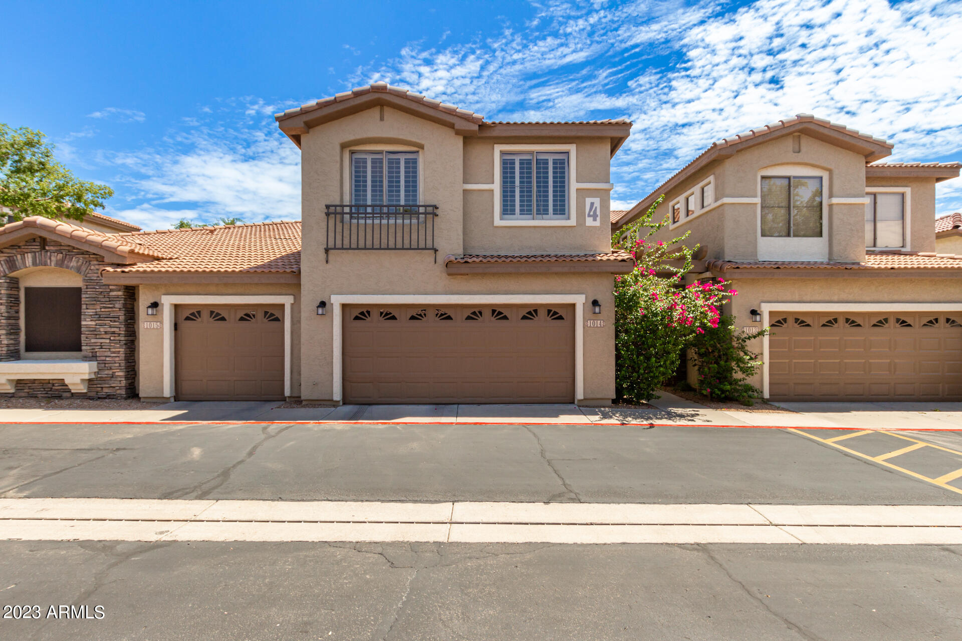 1024 East Frye Road, Unit 1014 Phoenix, AZ 85048 - Photo 1 of 29 a front view of a house with a yard and garage