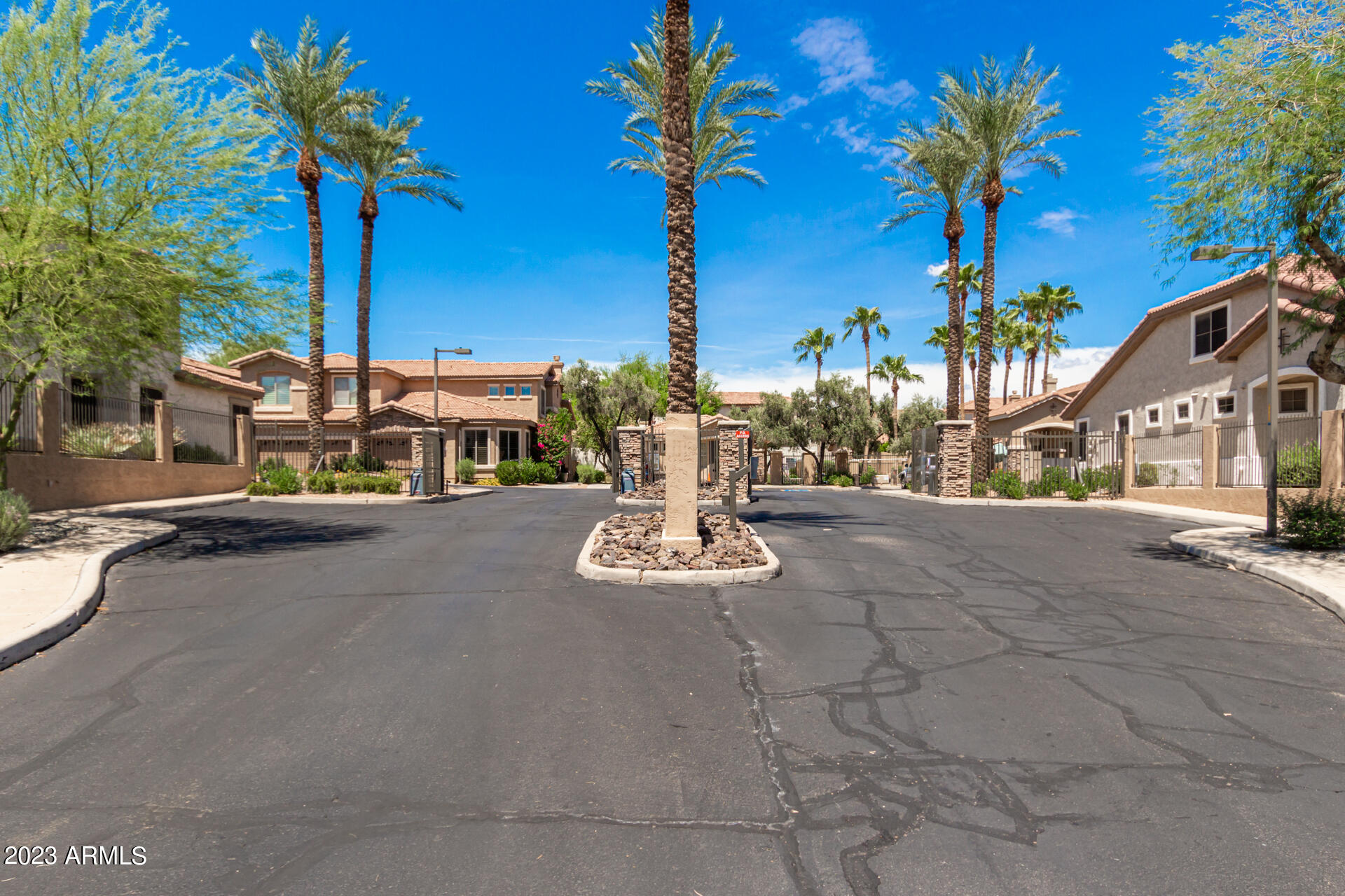 1024 East Frye Road, Unit 1014 Phoenix, AZ 85048 - Photo 7 of 29 a view of a street with a building and palm trees