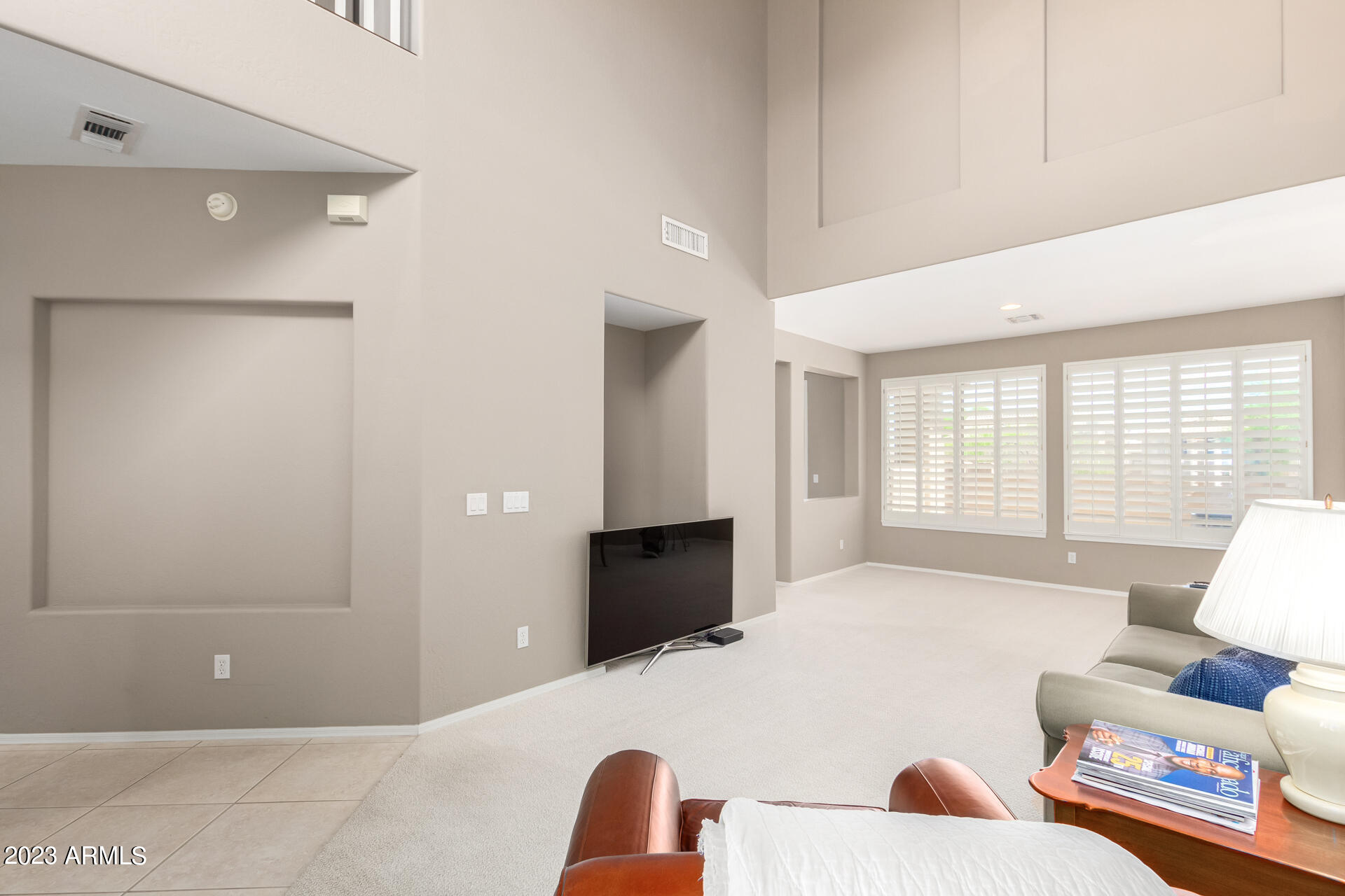 1024 East Frye Road, Unit 1014 Phoenix, AZ 85048 - Photo 10 of 29 a spacious bedroom with a bed and a couch