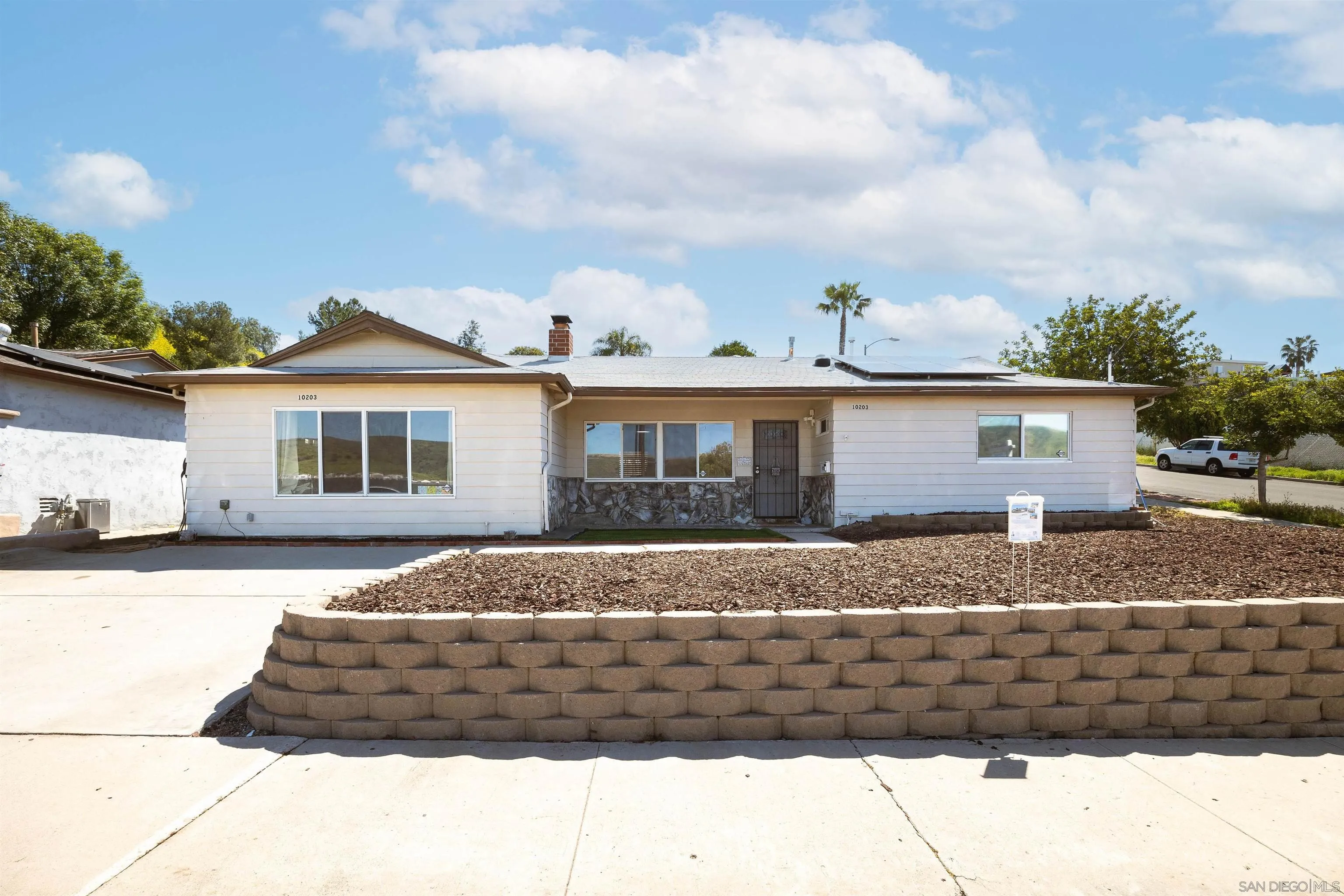 10203 Settle Road Santee, CA 92071 - Photo 1 of 33 a front view of a house with a yard