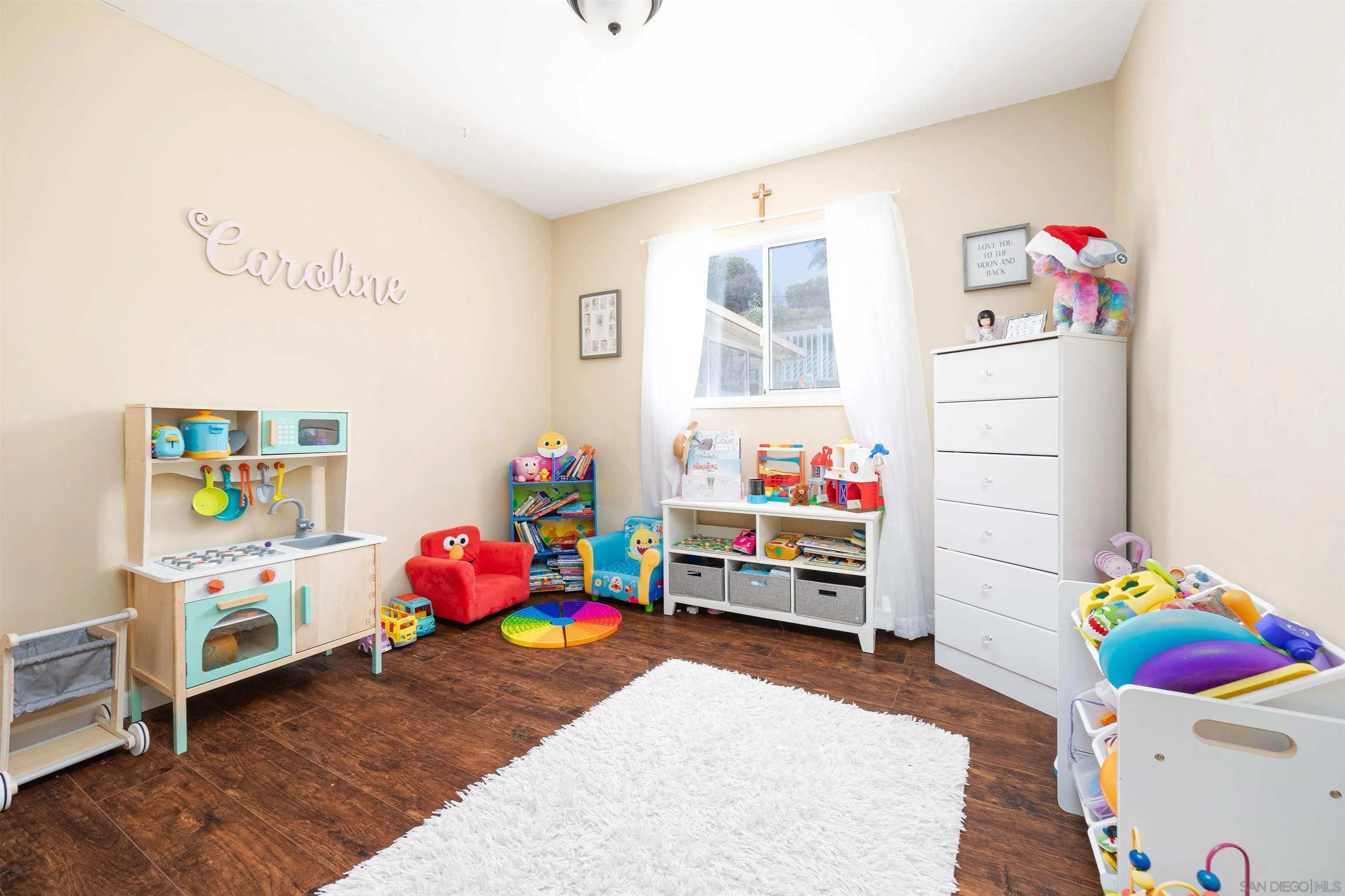 10203 Settle Road Santee, CA 92071 - Photo 12 of 33 a playing room with toys and a wooden floor