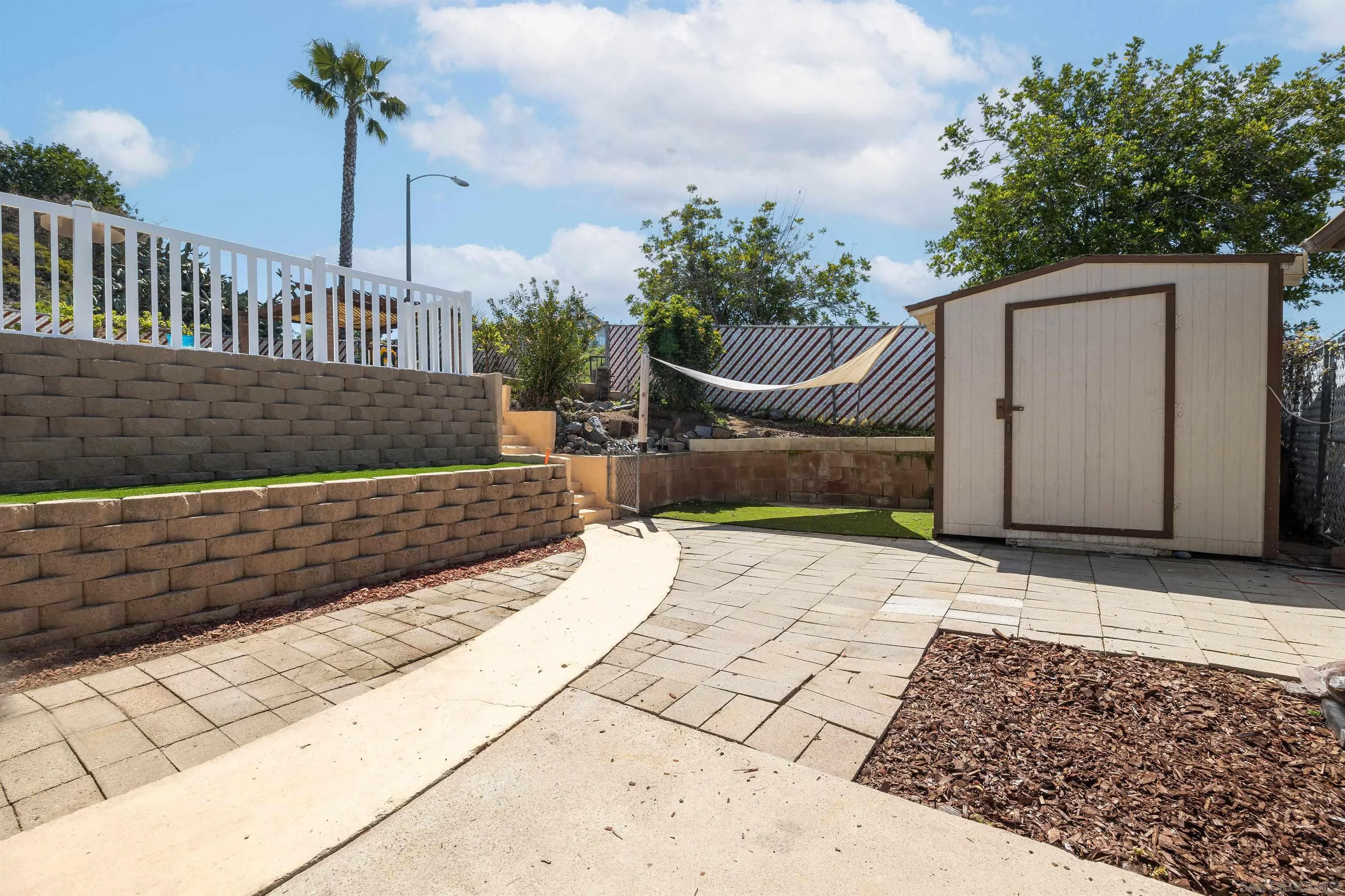 10203 Settle Road Santee, CA 92071 - Photo 18 of 33 a view of a pathway of a house