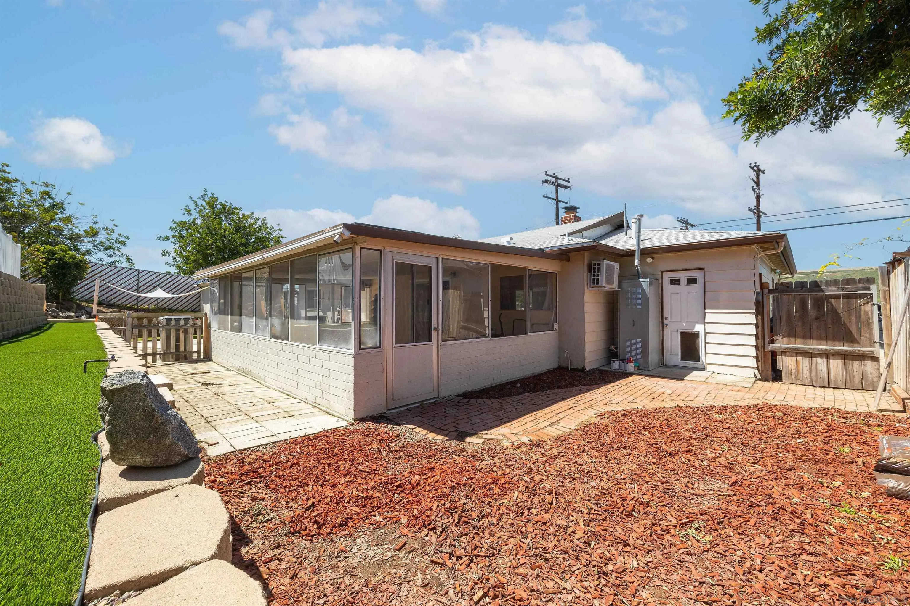 10203 Settle Road Santee, CA 92071 - Photo 23 of 33 a front view of a house with a yard and garage