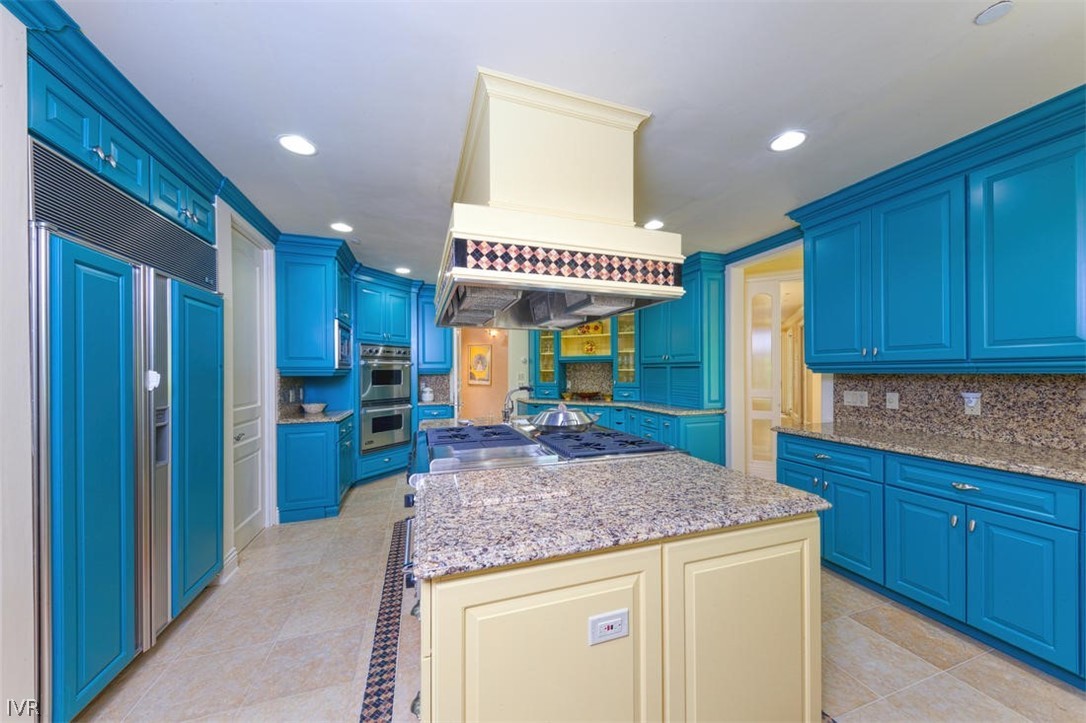 1580 Vivian Lane Incline Village, NV 89451 - Photo 11 of 35 a kitchen with kitchen island granite countertop wooden cabinets and a counter top space