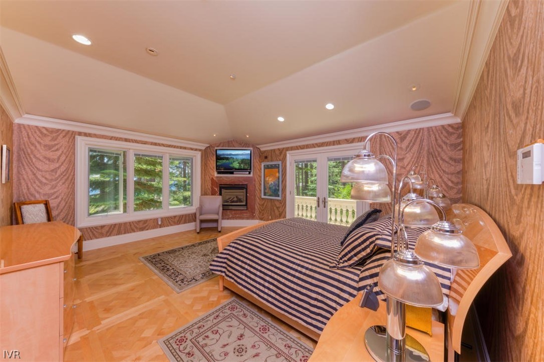 1580 Vivian Lane Incline Village, NV 89451 - Photo 18 of 35 a large bedroom with a bed and a large window