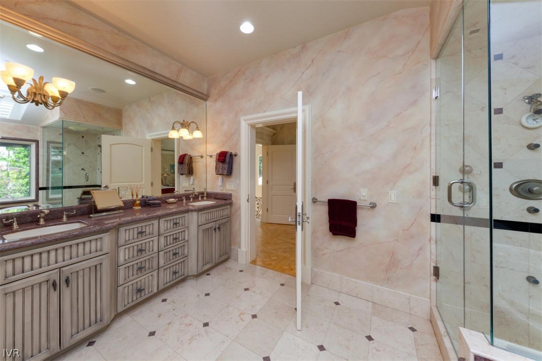 1580 Vivian Lane Incline Village, NV 89451 - Photo 21 of 35 a spacious bathroom with a shower a sink and mirror
