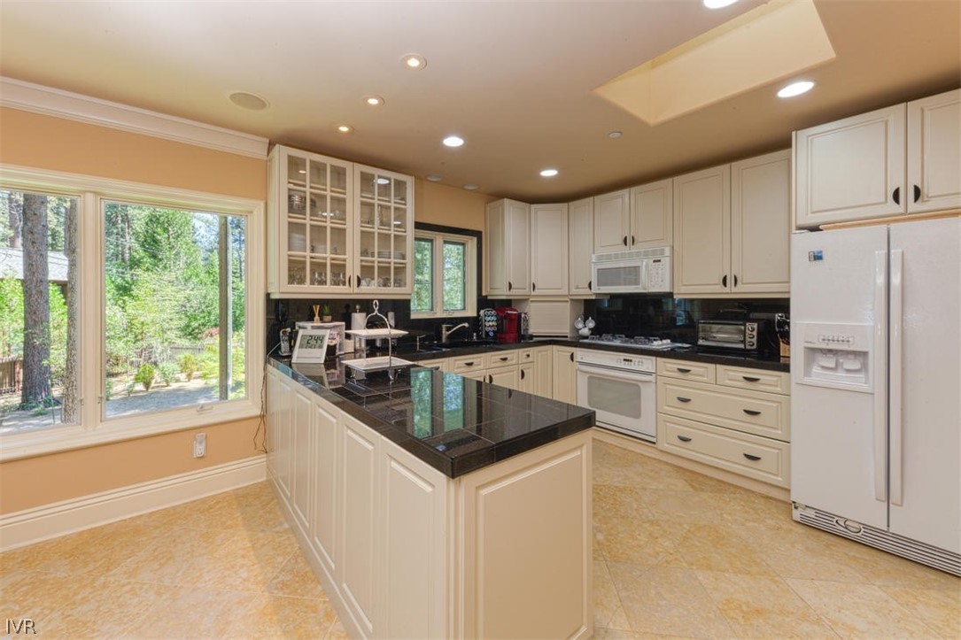 1580 Vivian Lane Incline Village, NV 89451 - Photo 28 of 35 a kitchen with stainless steel appliances granite countertop a stove a sink and a refrigerator