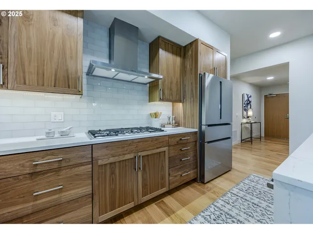 a bedroom with a bed and a night stand