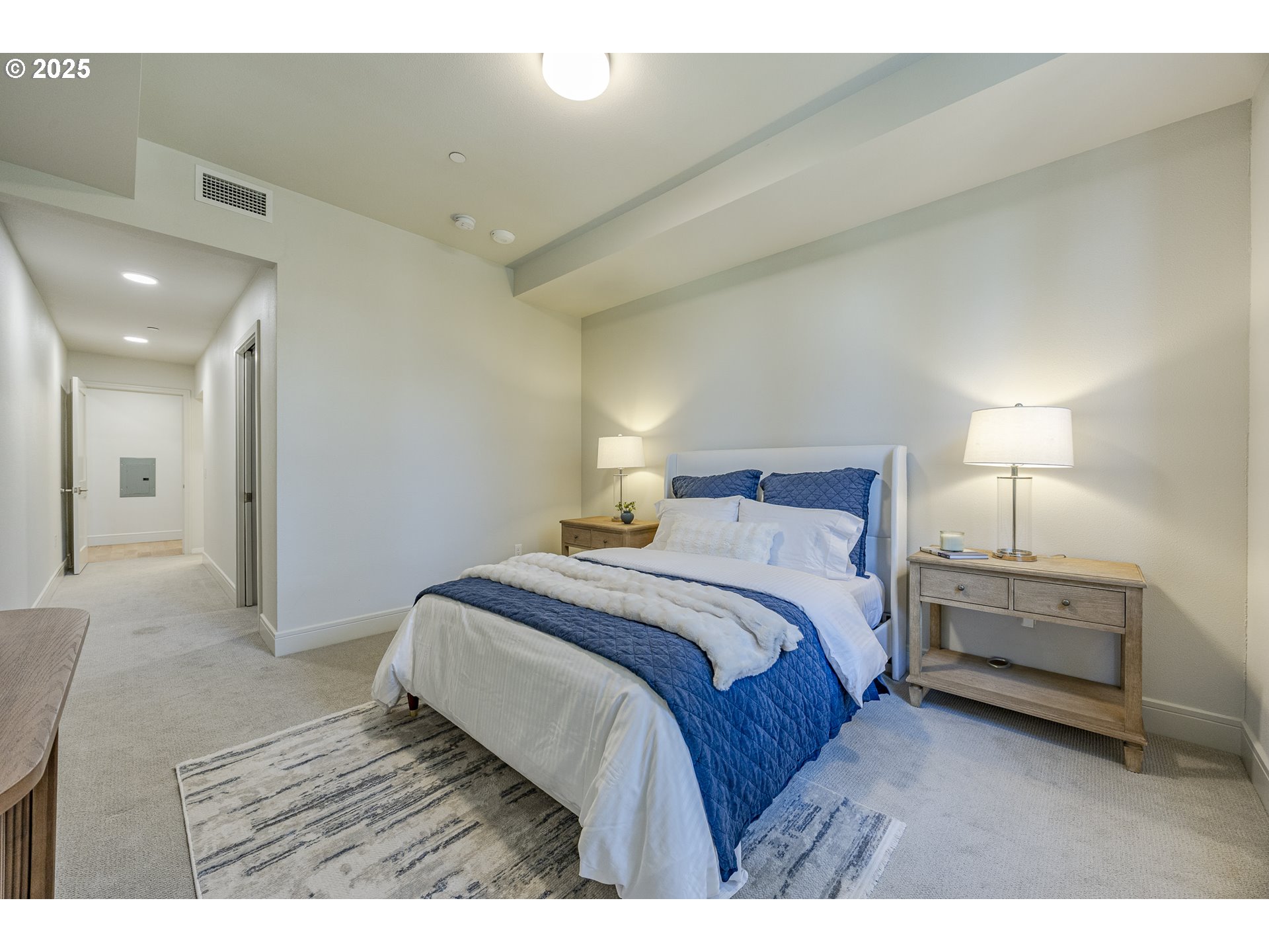 1600 Pearl Street, Unit 303 Eugene, OR 97401 - Photo 19 of 32 a bedroom with a bed and a night stand