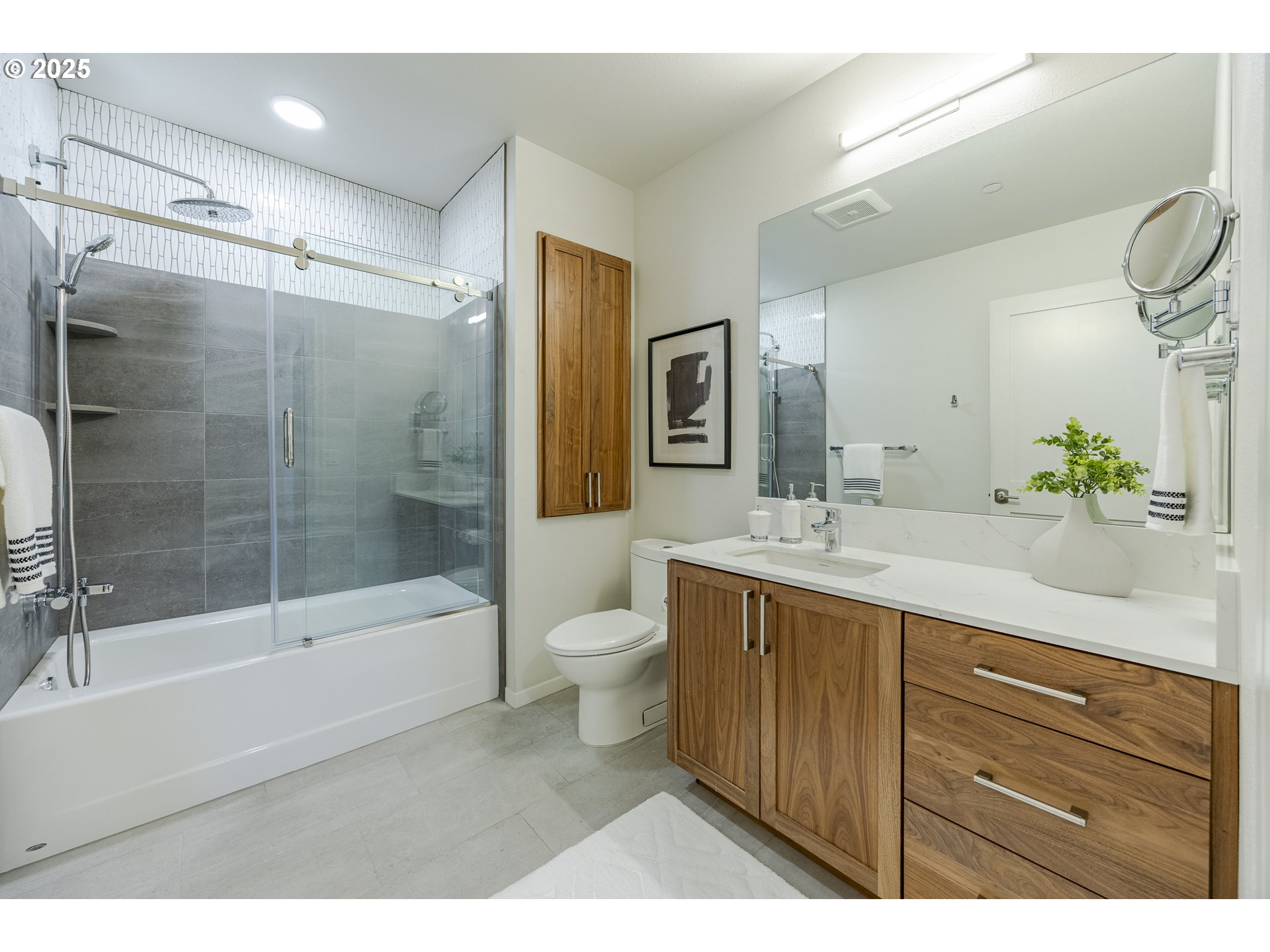 1600 Pearl Street, Unit 303 Eugene, OR 97401 - Photo 25 of 32 a bathroom with a bathtub shower sink and toilet