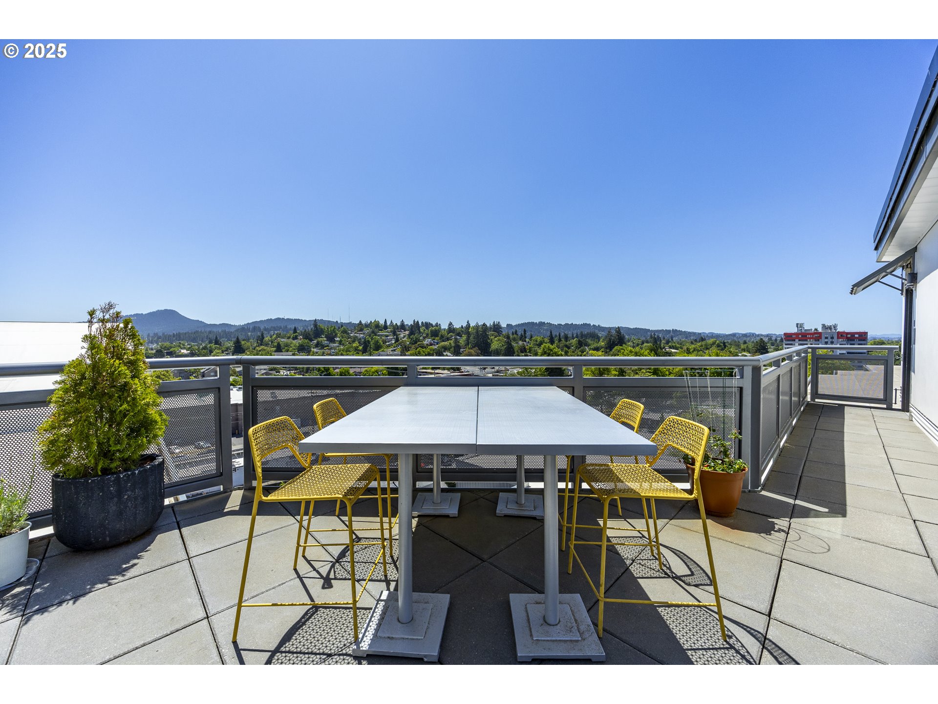 1600 Pearl Street, Unit 303 Eugene, OR 97401 - Photo 27 of 32 a view of a terrace with furniture and stove