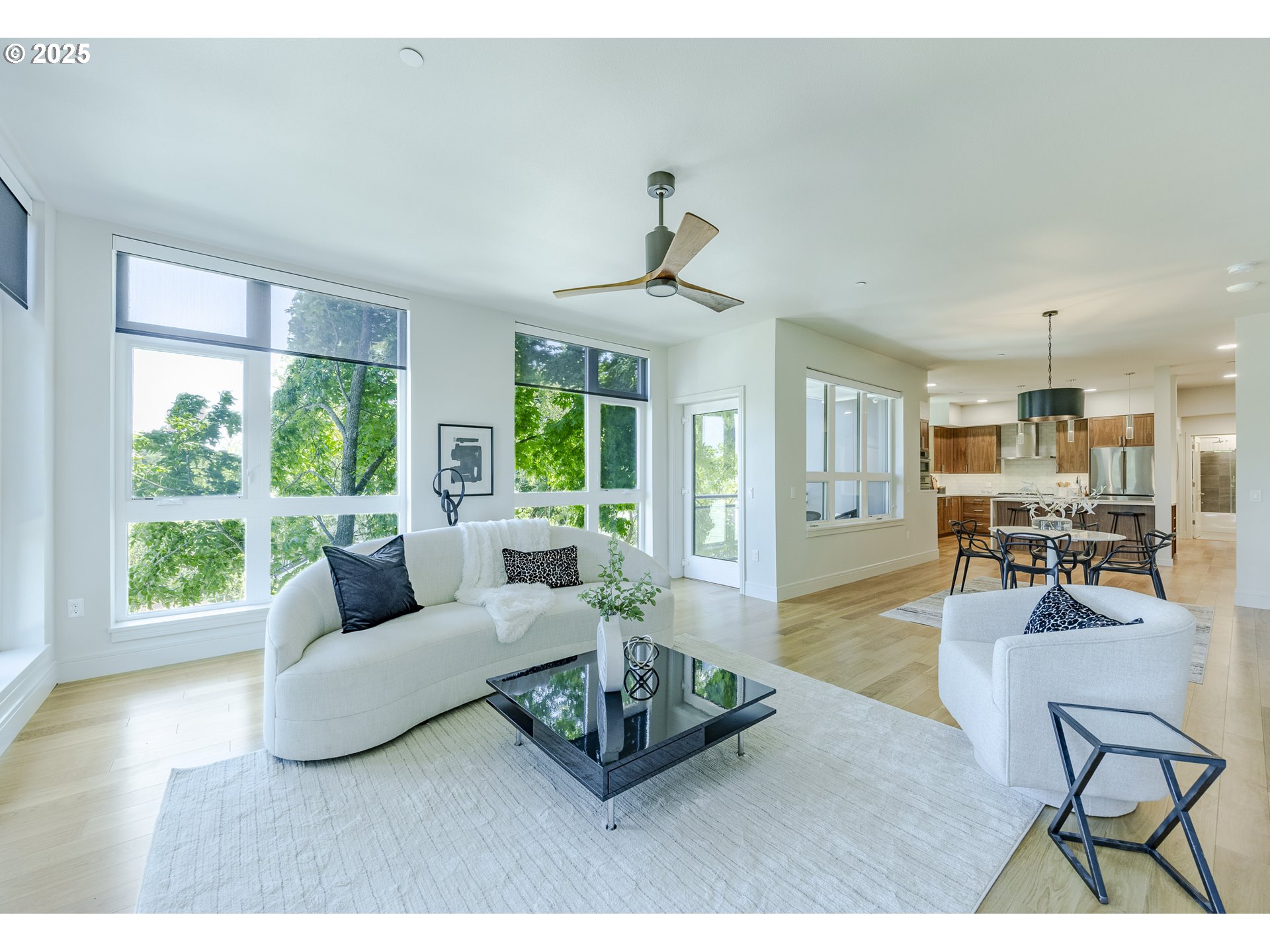 1600 Pearl Street, Unit 303 Eugene, OR 97401 - Photo 6 of 32 a living room with furniture and a large window