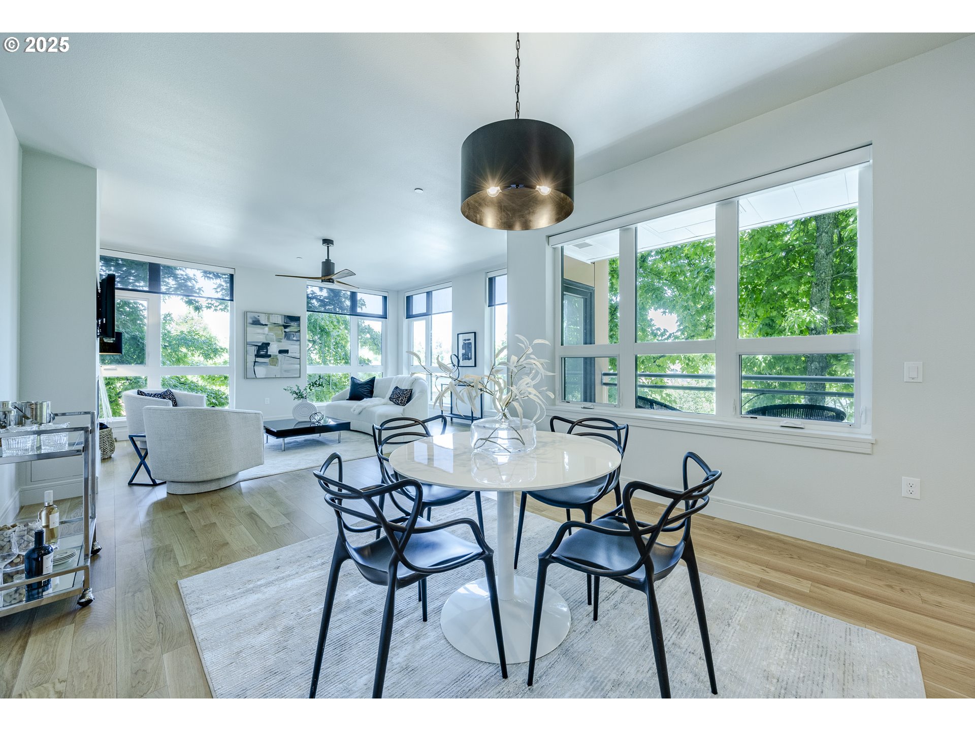 1600 Pearl Street, Unit 303 Eugene, OR 97401 - Photo 8 of 32 a view of a dining room with furniture window and wooden floor
