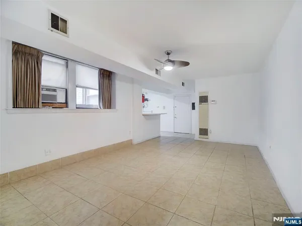 a view of empty room with windows