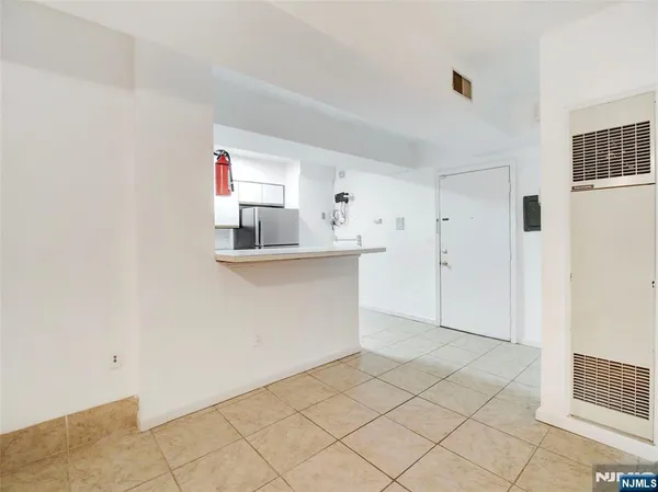 a room view with wooden floor and cabinet