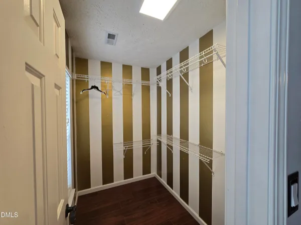 a bedroom with bed and window