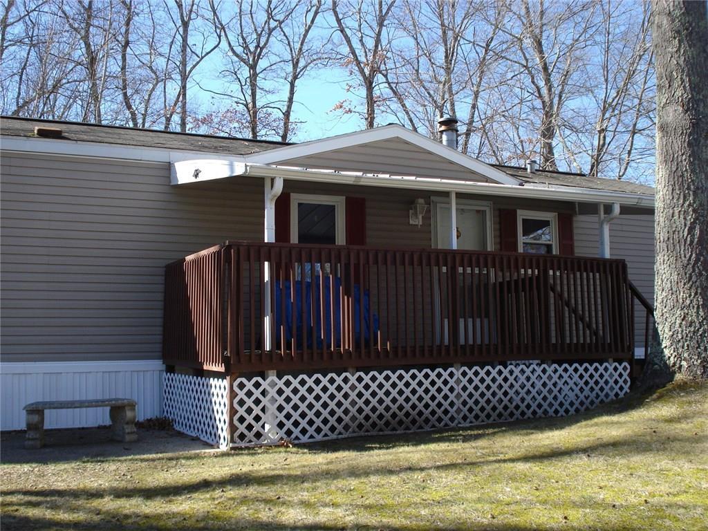 a view of a house with a wooden deck