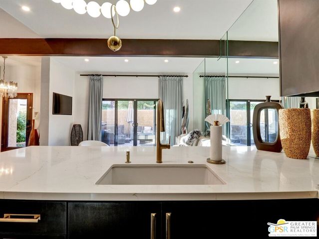 a kitchen with a sink and a refrigerator