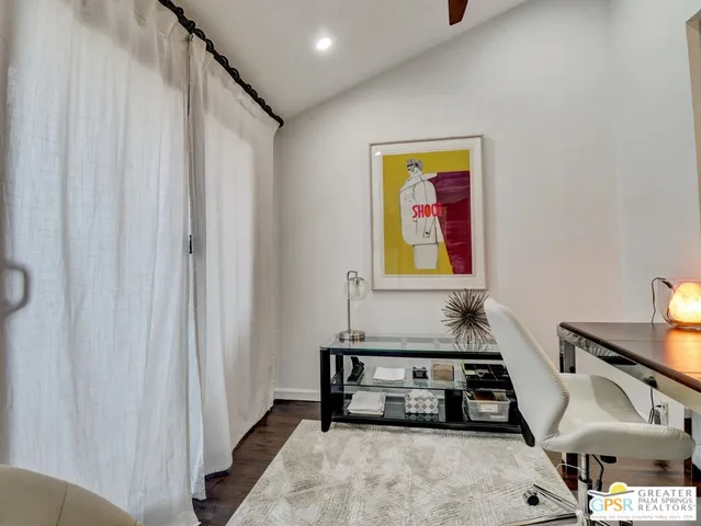 a bedroom with bed and a window