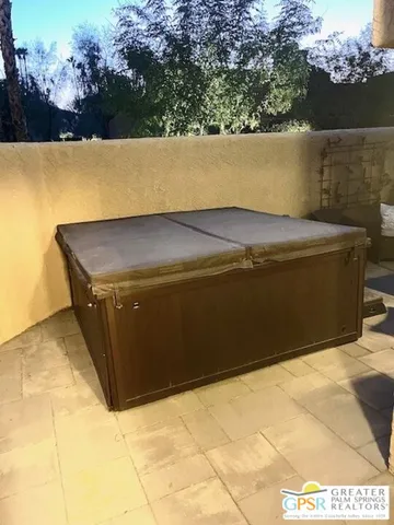 a view of a pool in a backyard