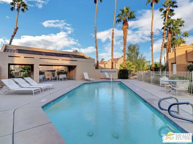 a view of a swimming pool with a patio