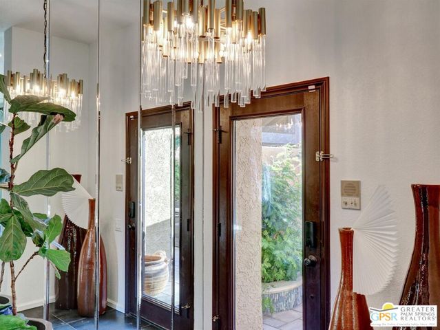 a bathroom with a shower and a plant
