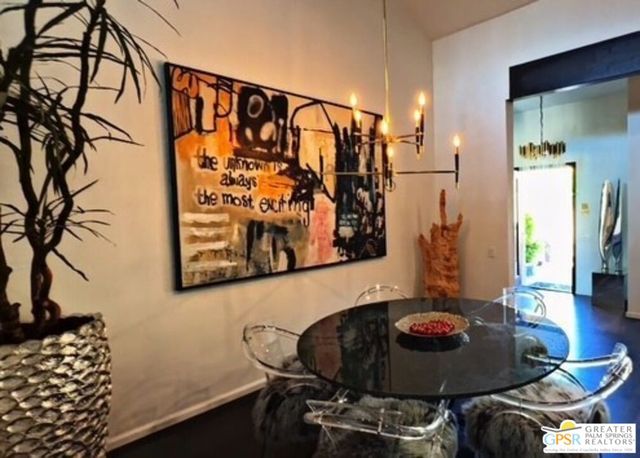 a living room with rug and wooden floor