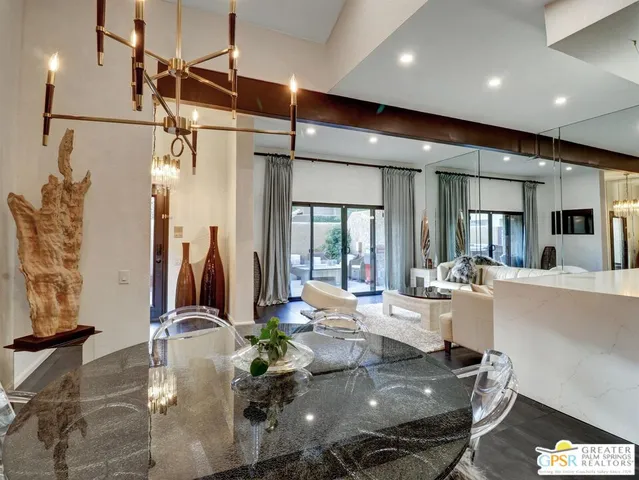 a very nice looking dining room with furniture