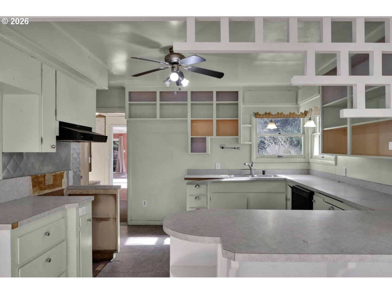 90136 Green Creek Road Swisshome, OR 97480 - Photo 18 of 42 a kitchen with cabinets and window