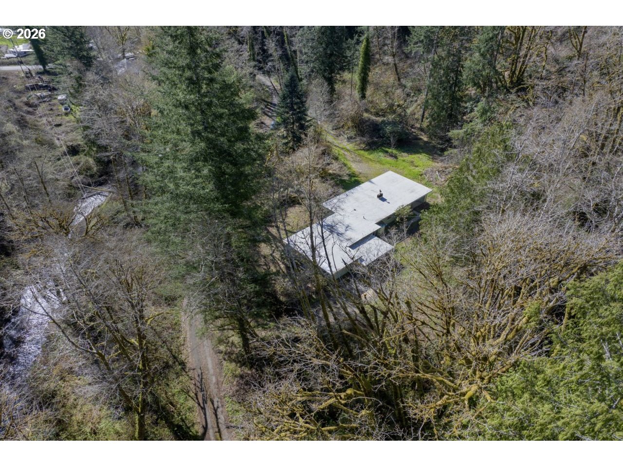 90136 Green Creek Road Swisshome, OR 97480 - Photo 40 of 42 a aerial view of a house with a yard