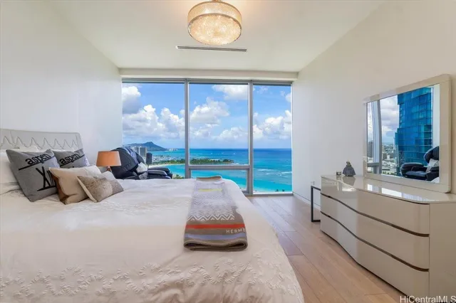 a bedroom with bed and balcony