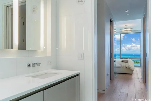 a en suite bathroom with a sink and mirror