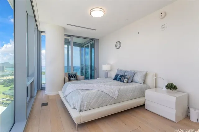 a bedroom with a bed and a couch