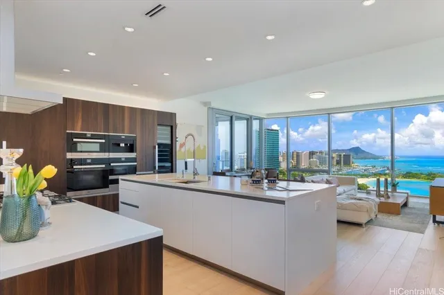 a kitchen with lots of counter top space and appliances