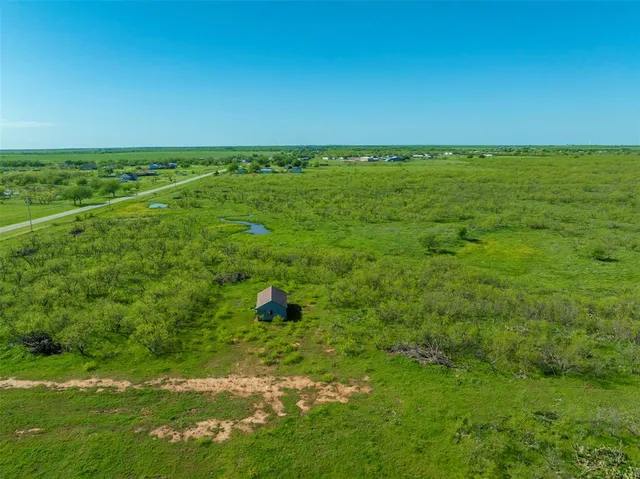a view of an ocean and yard