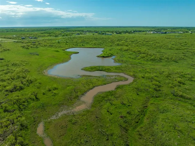 a view of a lake with beach