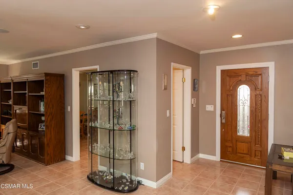 a kitchen with a refrigerator and a sink