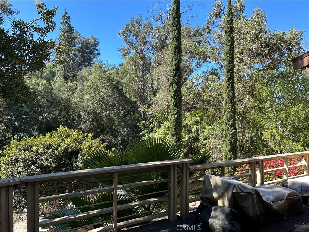 300 South Timken Road Anaheim, CA 92808 - Photo 38 of 40 a view of a balcony with wooden floor and fence