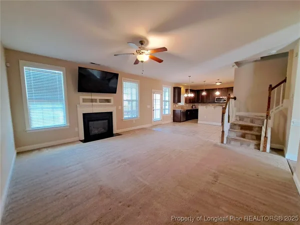a view of livingroom with furniture flat screen tv and fire place