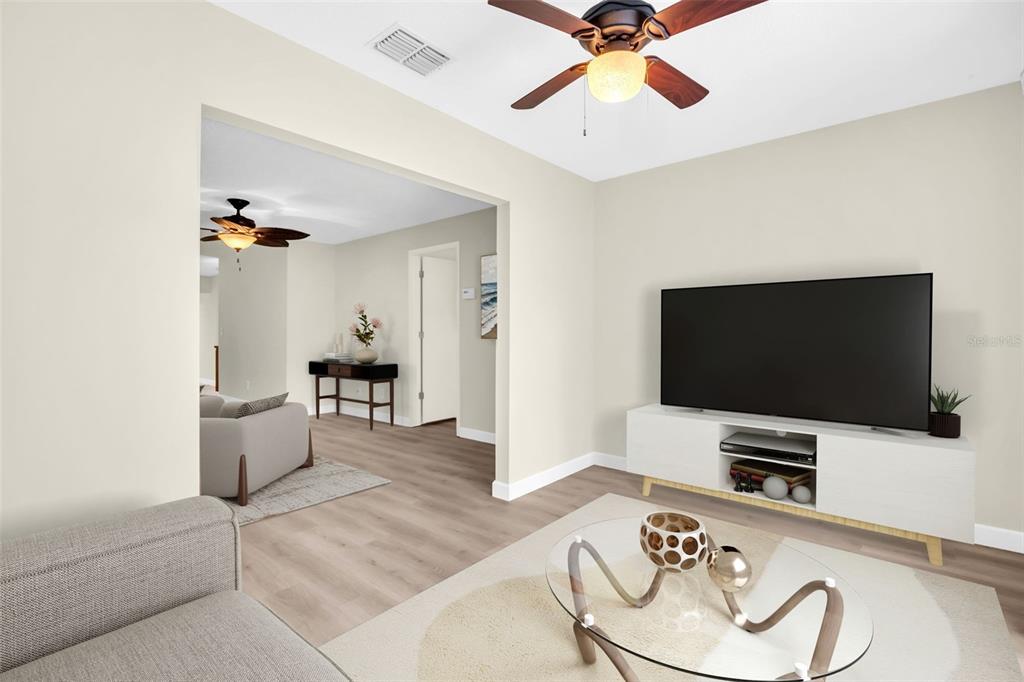 899 Cleland Court, Unit A Palm Harbor, FL 34684 - Photo 20 of 51 a living room with furniture and a flat screen tv