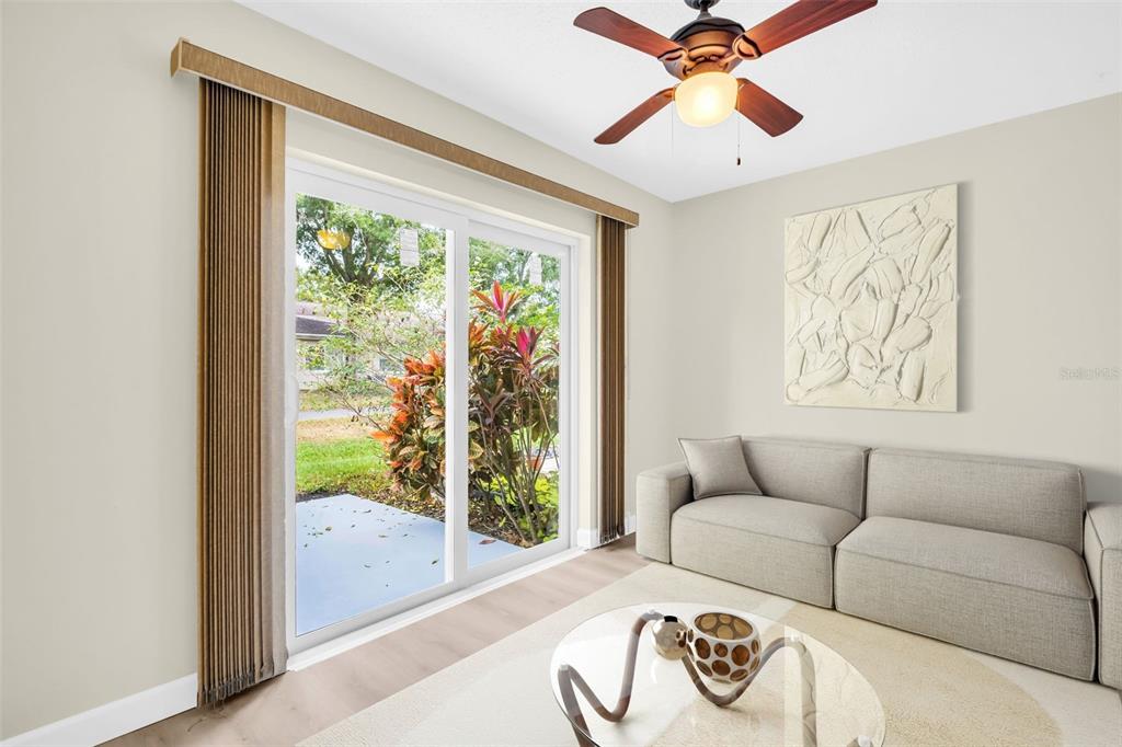 899 Cleland Court, Unit A Palm Harbor, FL 34684 - Photo 21 of 51 a living room with furniture and a window