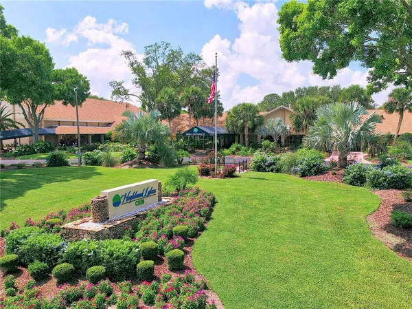 a view of a swimming pool with an outdoor seating