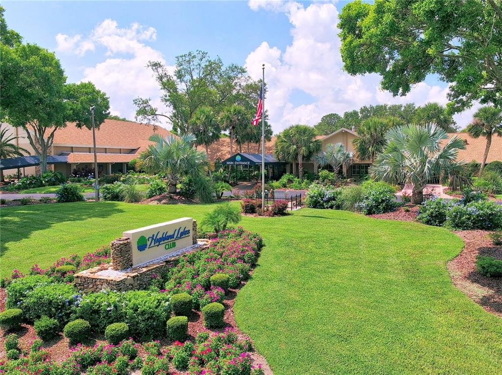 899 Cleland Court, Unit A Palm Harbor, FL 34684 - Photo 36 of 51 a view of a garden with a building in the background